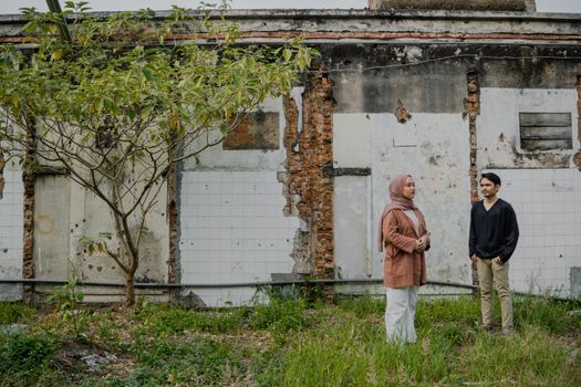 Man and Woman by Building