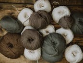 Brown Gray and White Yarn Rolls