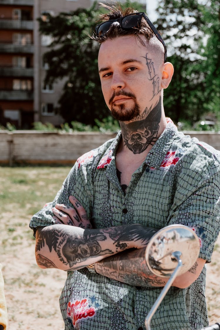 A Tattooed Man With A Goatee