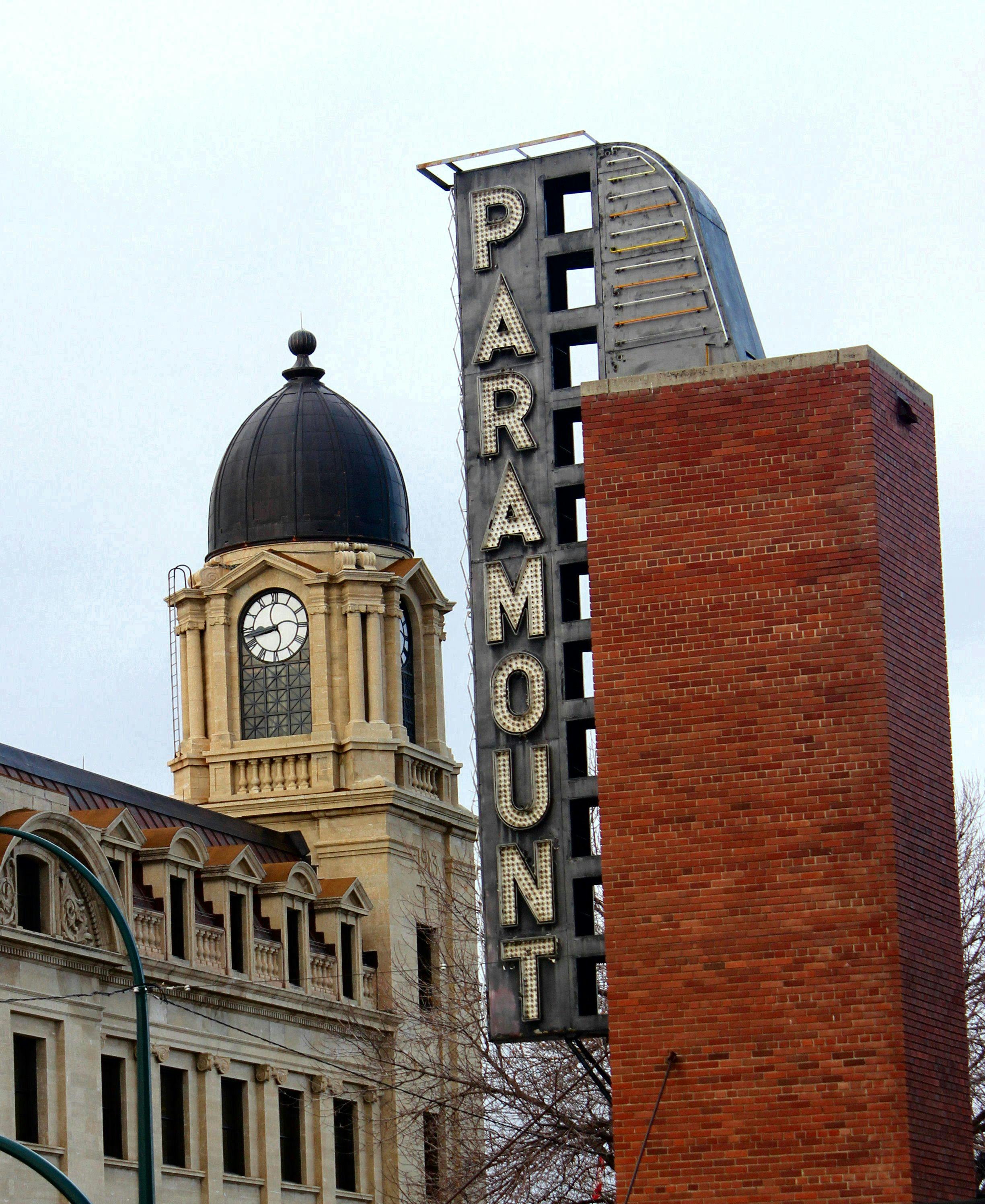 Free Up-close view of the iconic Paramount marquee beside a classic clock tower. Stock Photo