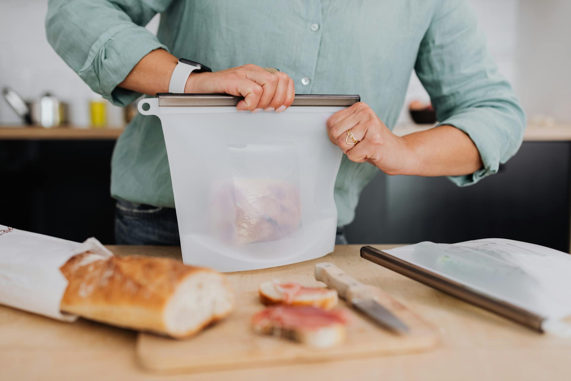 Woman Enclosing Food in Silicone Bag