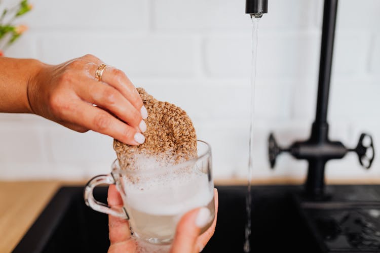 Woman Washing Glass In Close Up