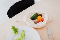 Multicoloured Vegetables in a Textile Bag on Table