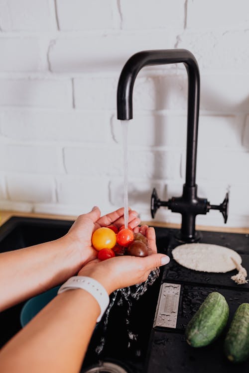 Close-up of Woman Washing Vegetables under Tap Water