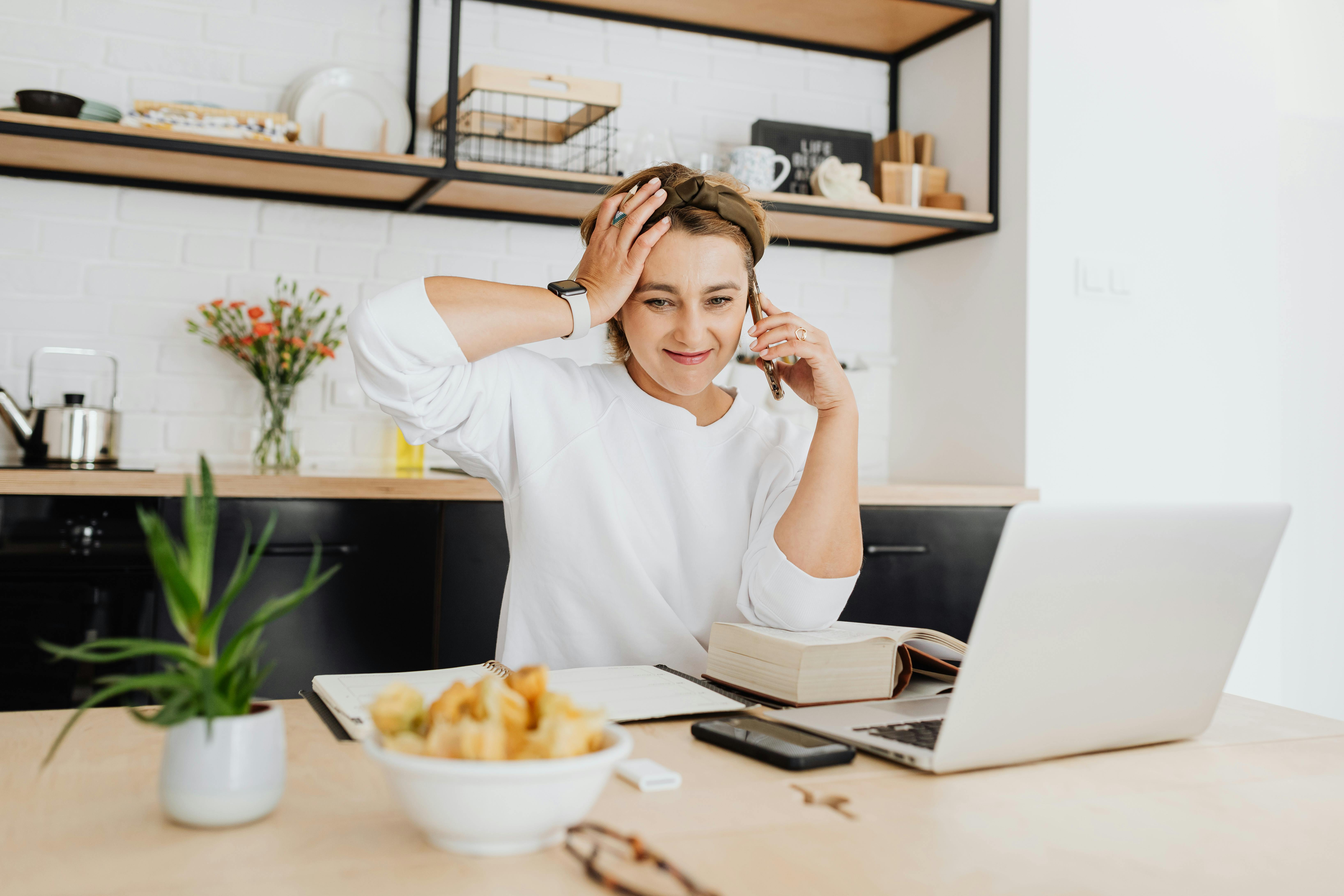 home desk or kitchen table before work starts reviewing the first work tasks before opening distractions lifestyle photo 2
