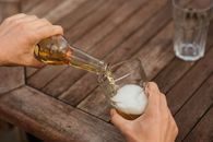Man pouring beer in glass