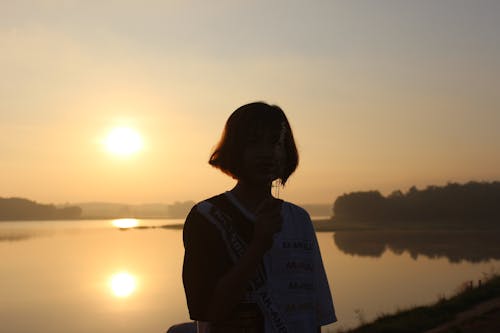 Free Silhouette of a Woman during Sunset Stock Photo