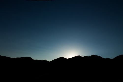 Free stock photo of against the sun, beautiful sunset, coastal mountain
