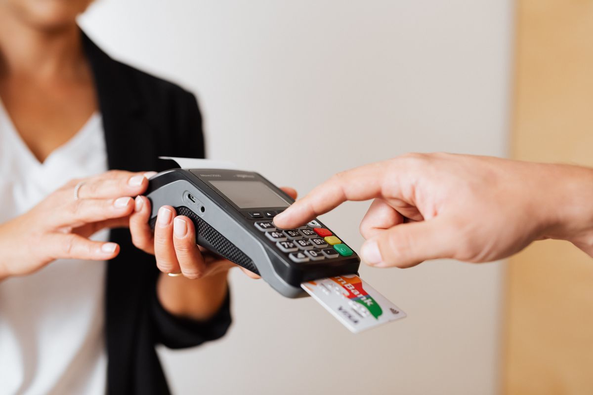 Customer completing payment using a secure payment terminal