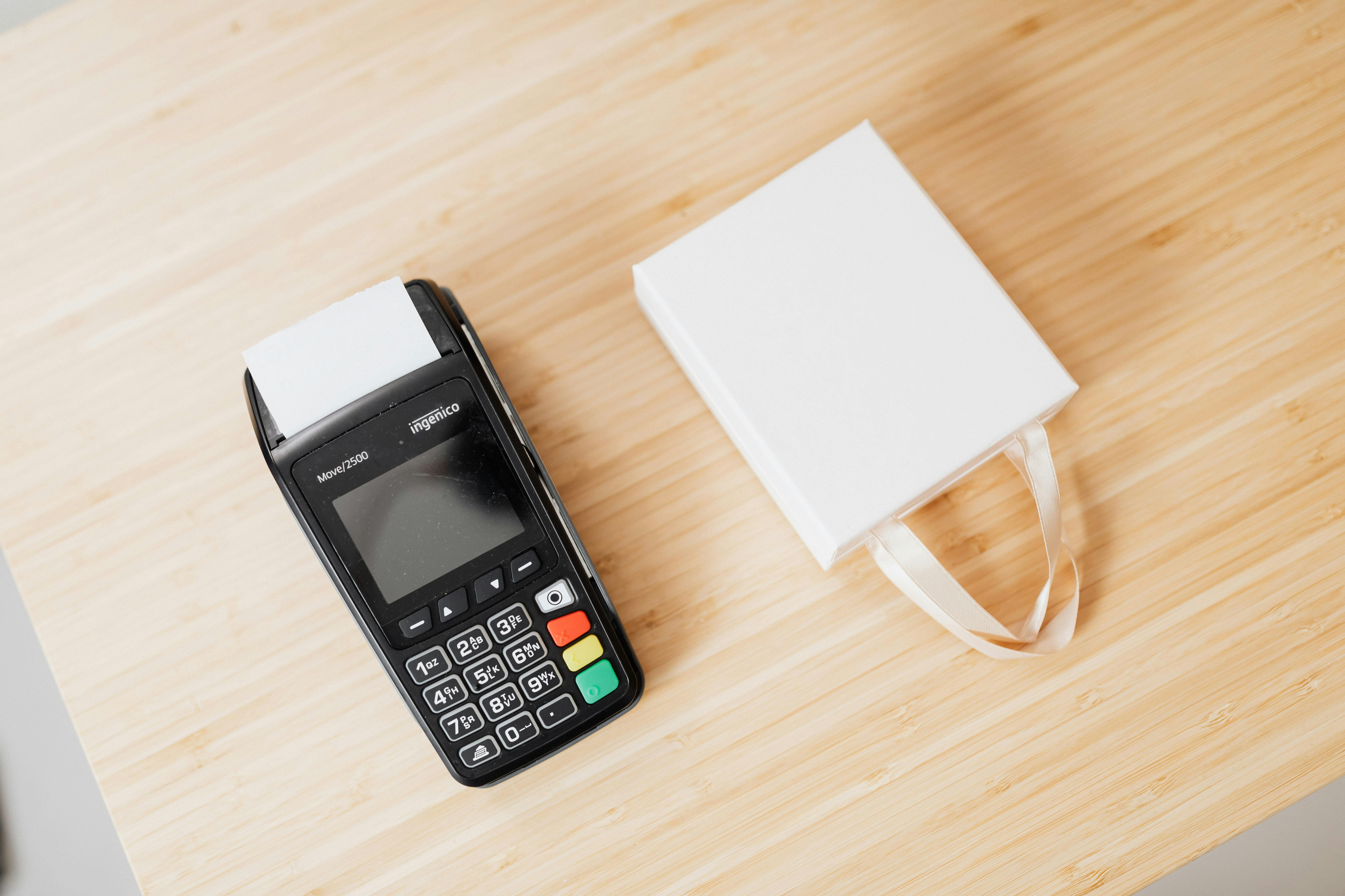 digital terminal beside a white box