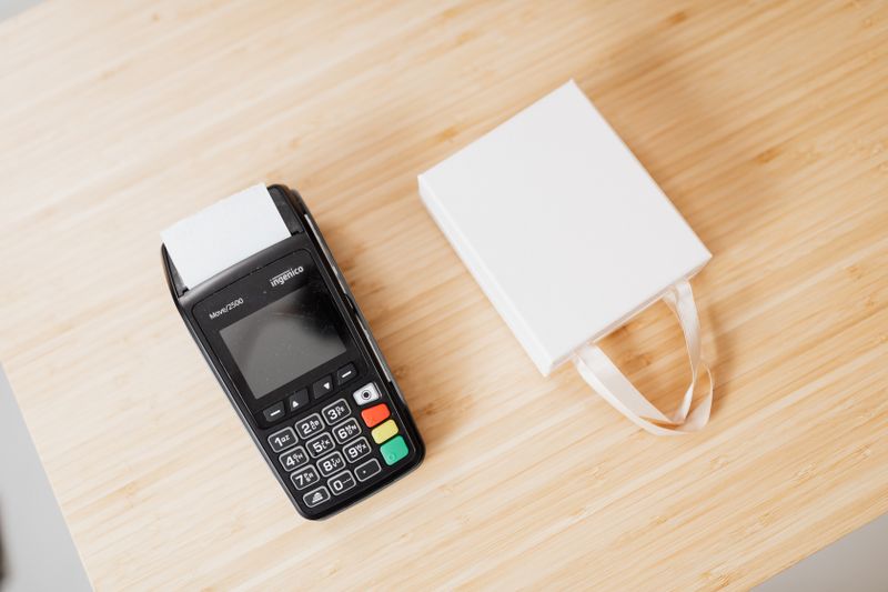A card payment terminal on a shop countertop — photo by kaboompics.com on Pexels