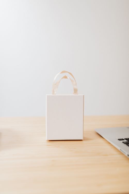 Small White Box on the Wooden Table Top · Free Stock Photo