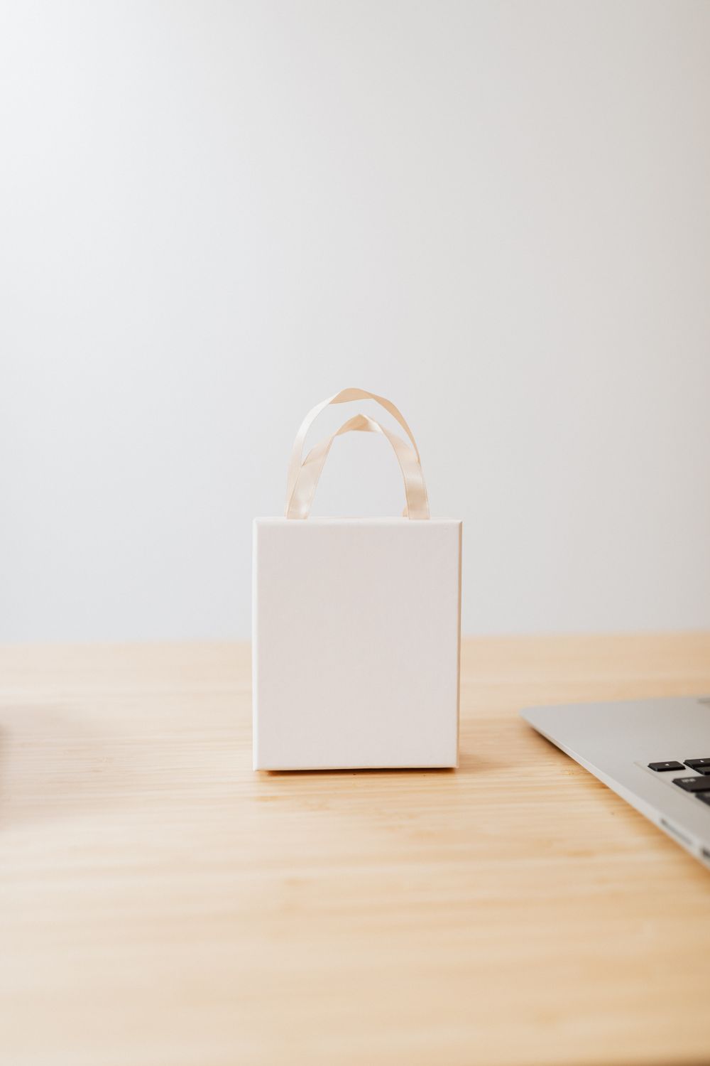 Small White Box on the Wooden Table Top · Free Stock Photo