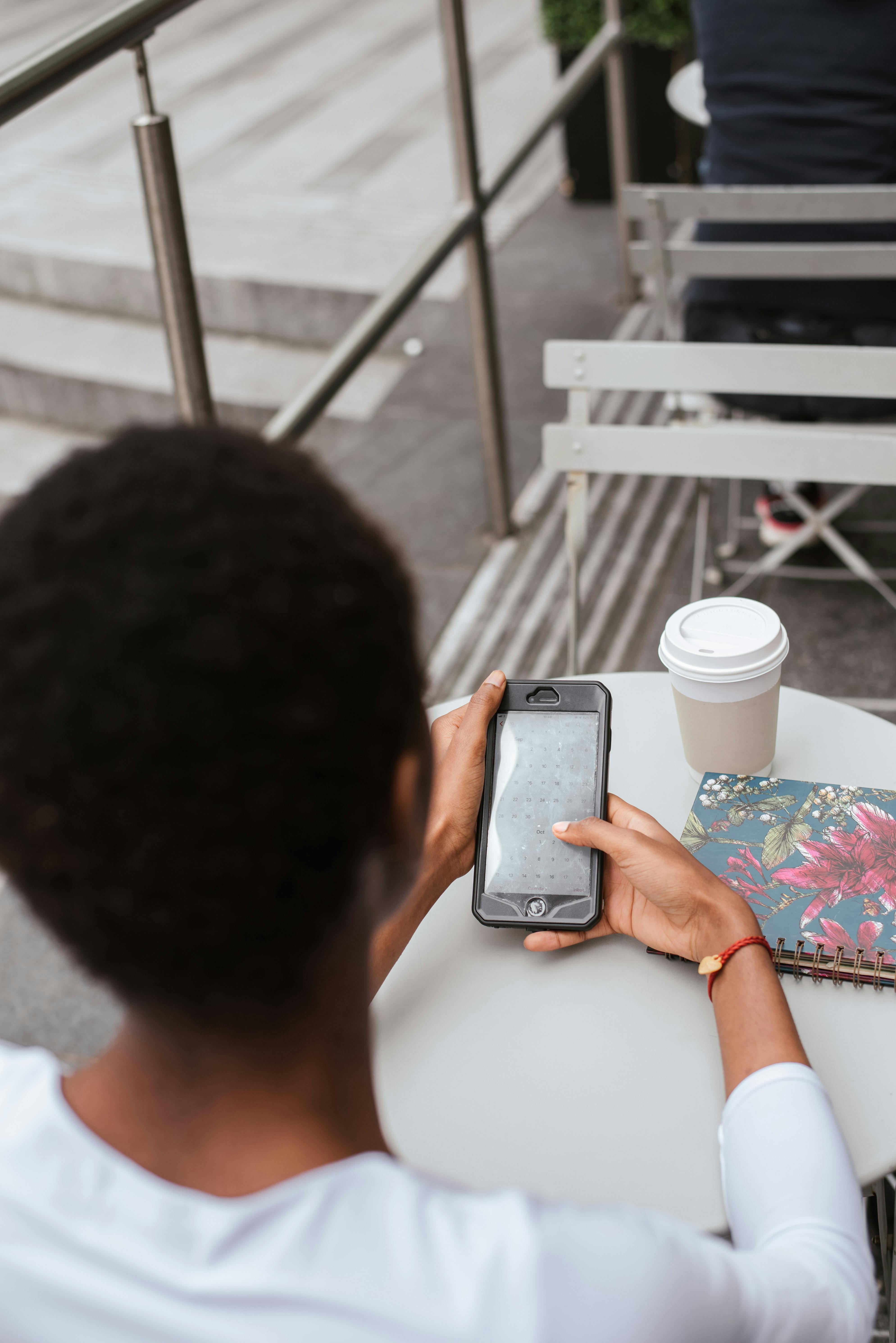 crop woman messaging on smartphone