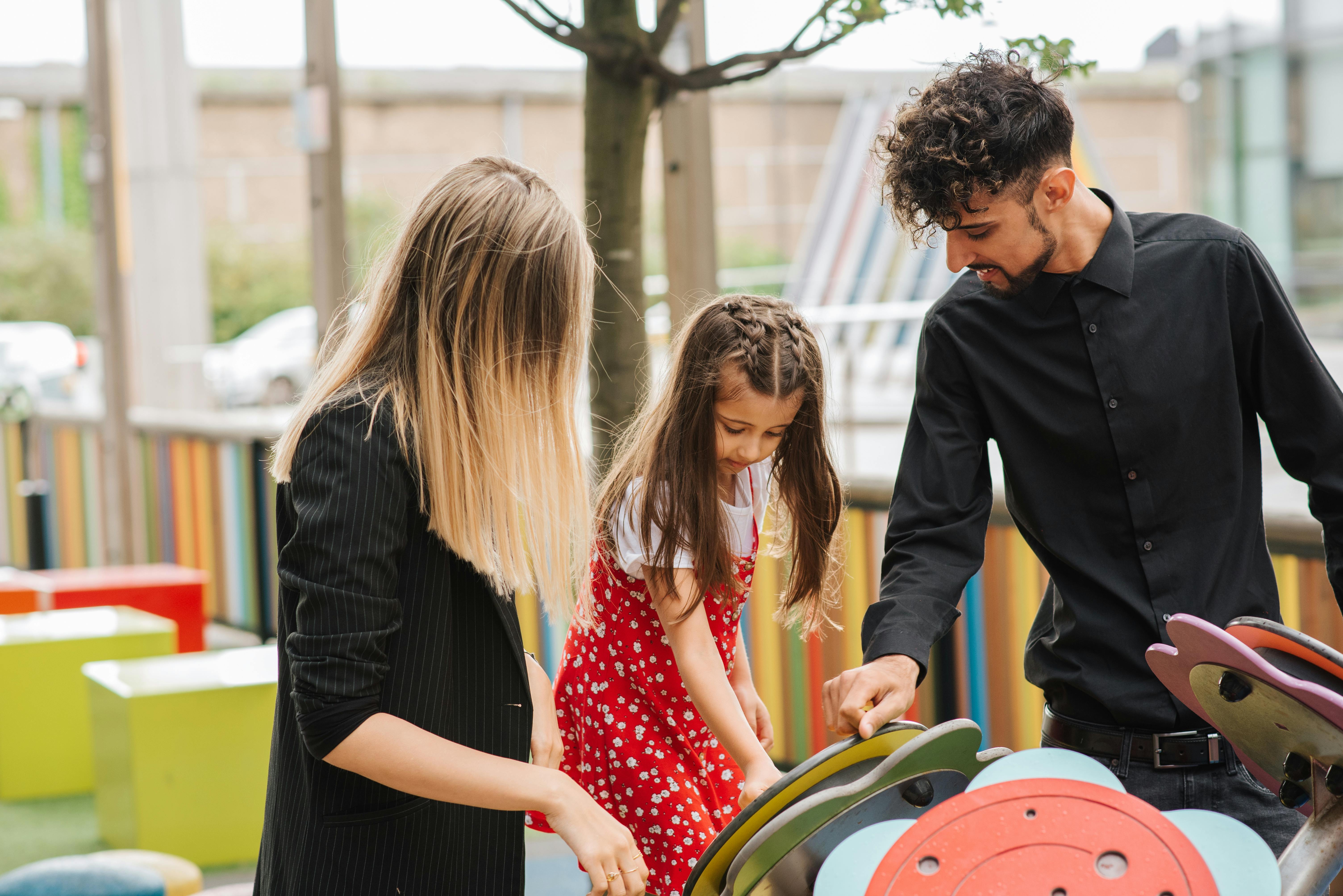 family spending time on playground together