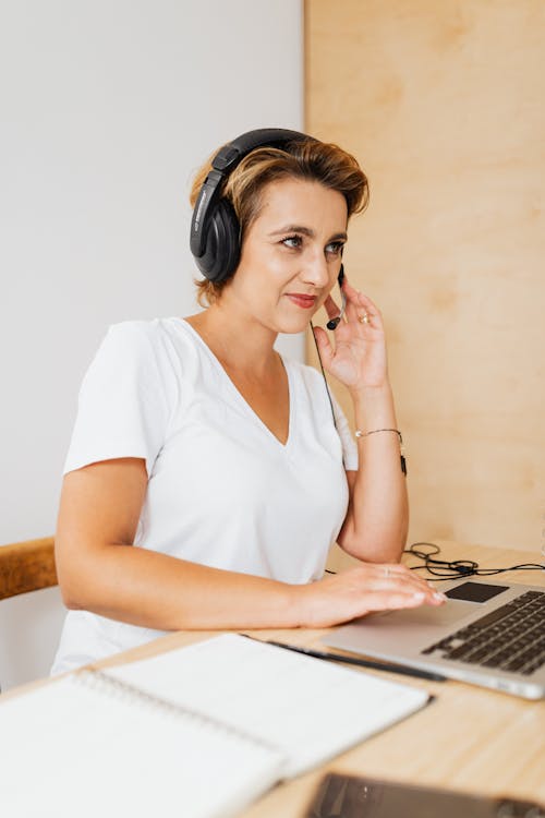 Woman wearing headset provides support to a caller