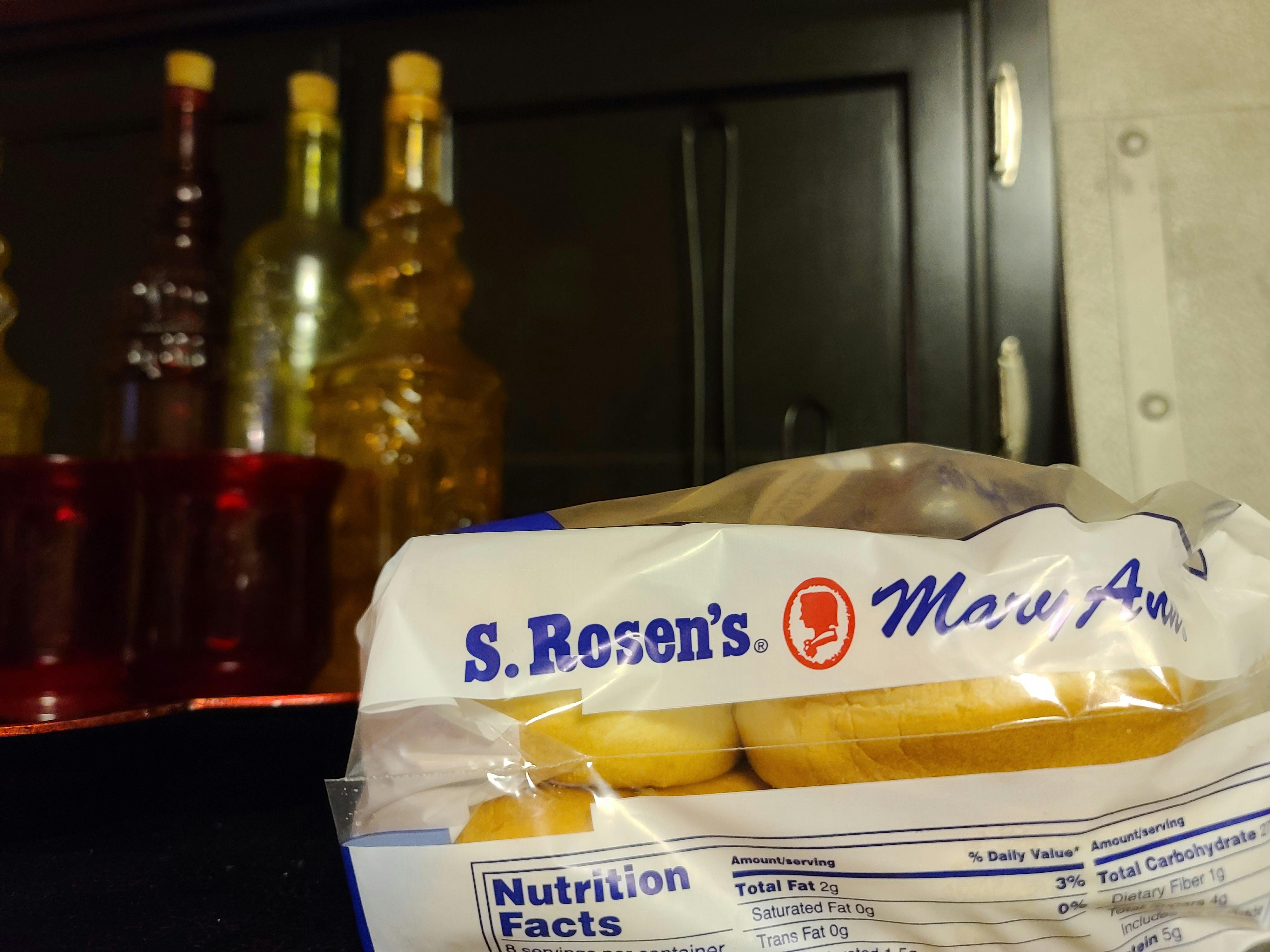 Toddler in back carry position with ergonomic carrier during hike