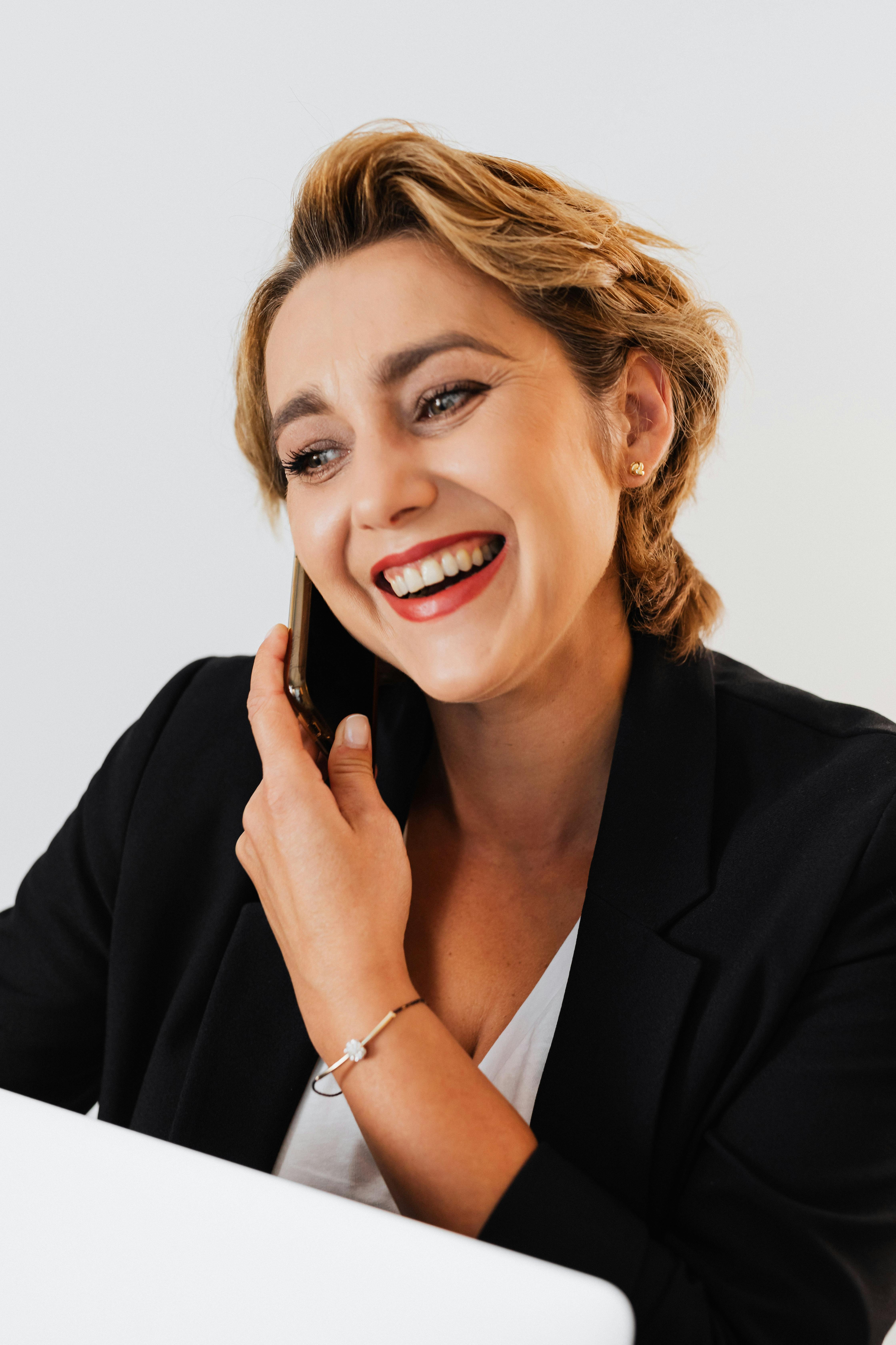 businesswoman talking on the phone and smiling