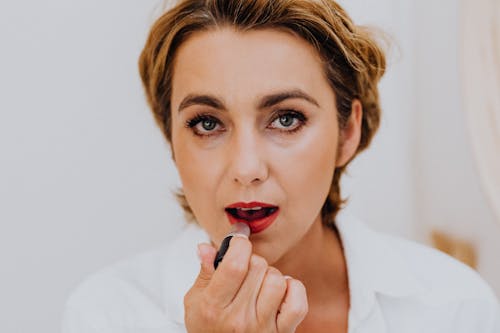 Woman in White Shirt With Red Lipstick