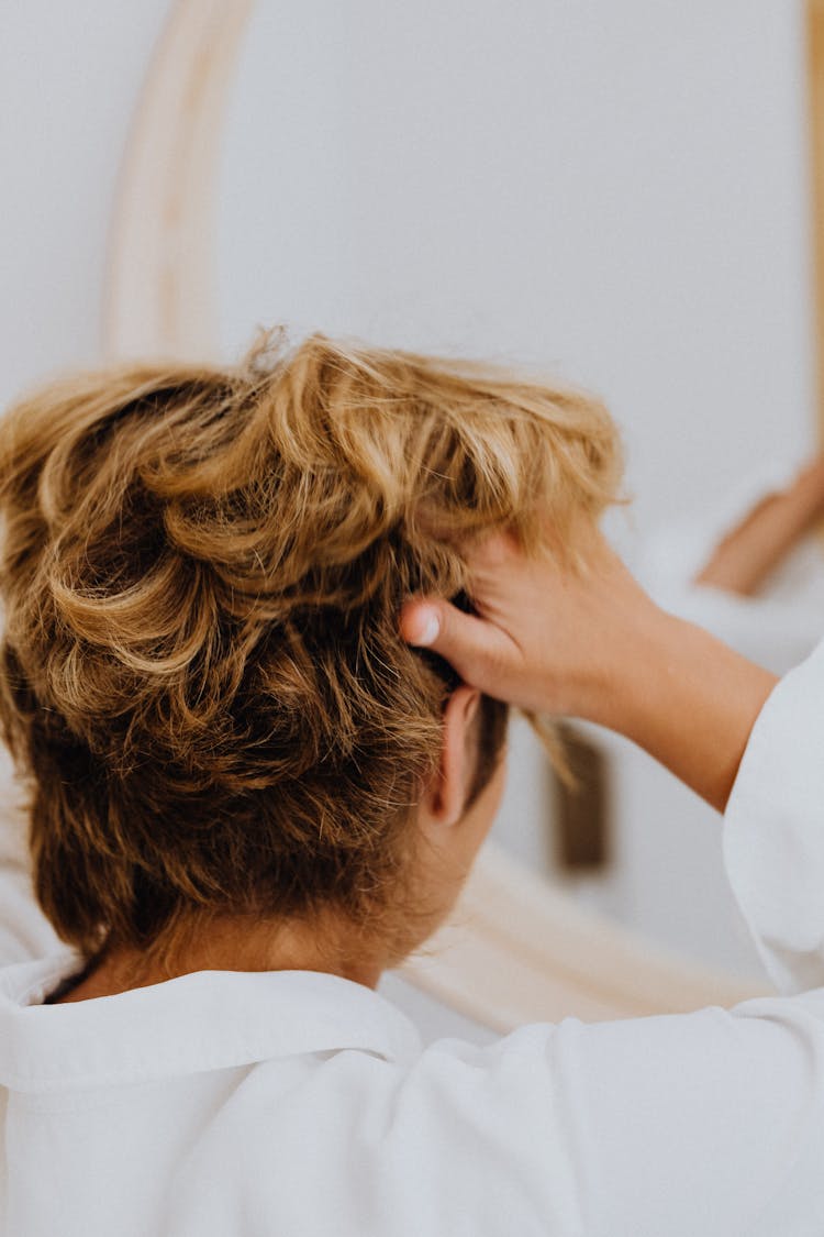 Person Combing Hair With Fingers 