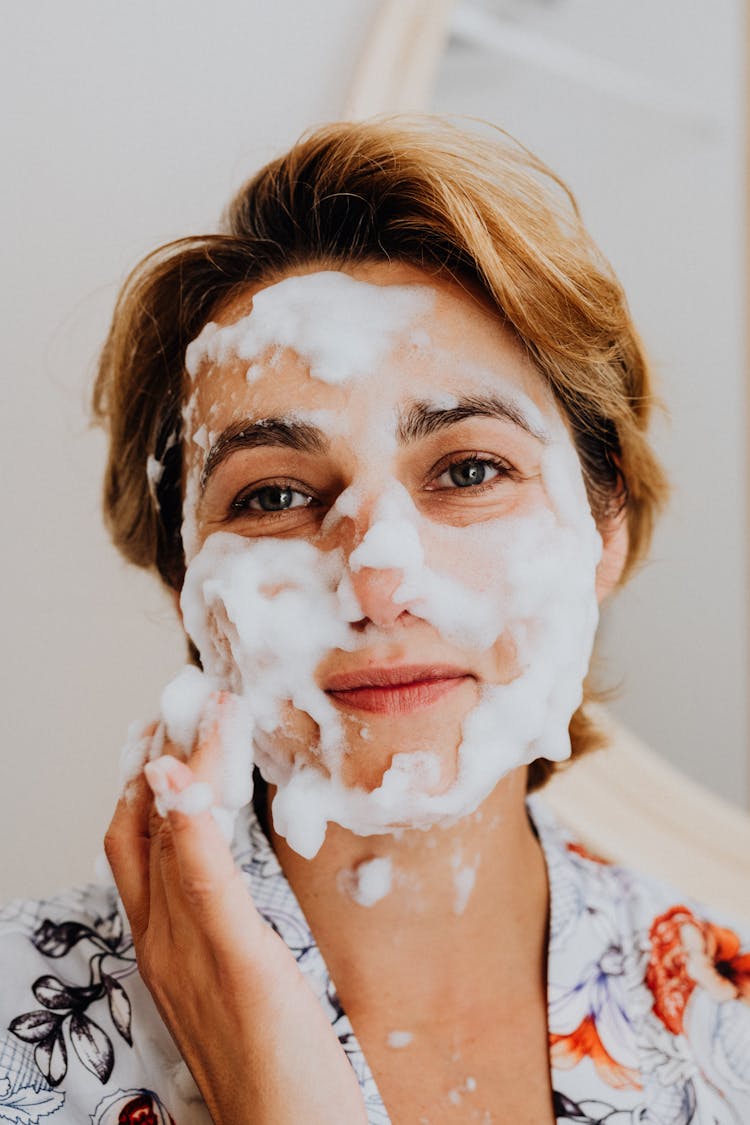 Woman With Foam On Her Face