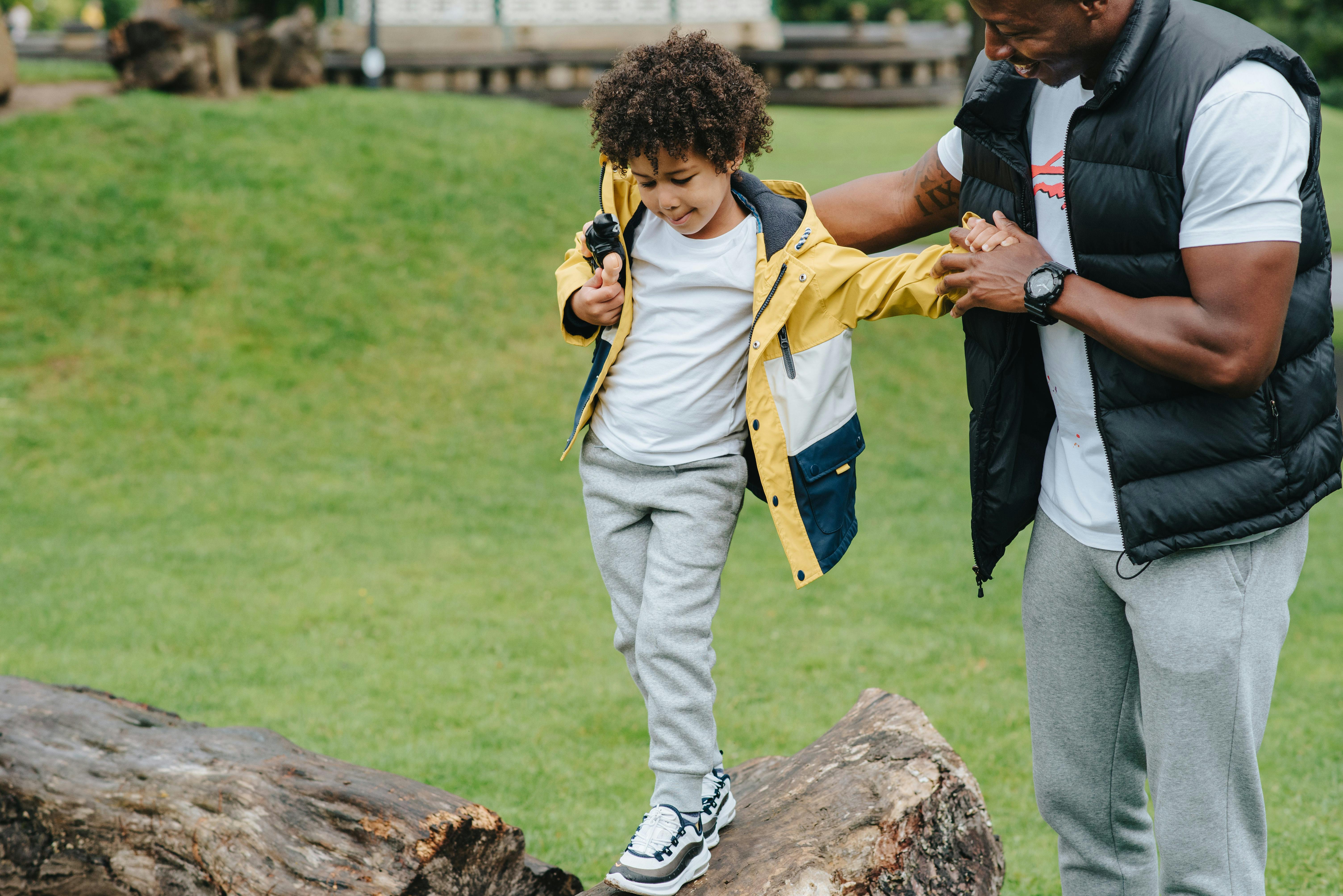 crop black man supporting son