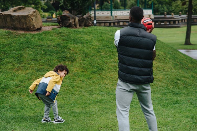 Unrecognizable Black Father Playing With Kid