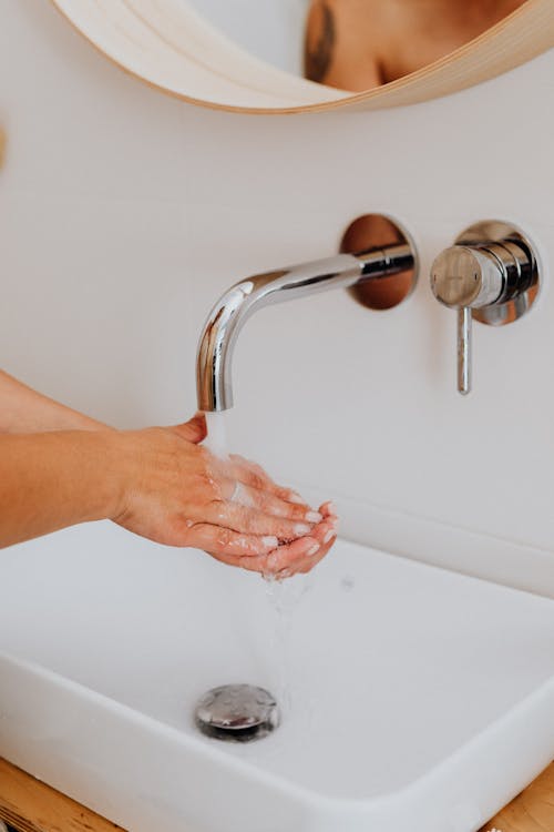 Free Person Cleaning Hands on Lavatory  Stock Photo
