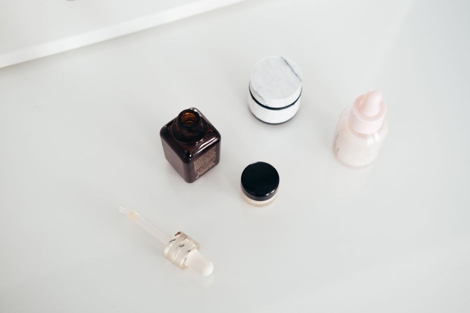 image of various skincare products on a clean background - how to lighten acne scars on face image of various skincare products on a clean background - how to lighten acne scars on face