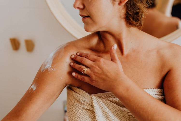 Woman Applying Body Lotion 