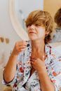 Woman Applying Perfume on Herself 