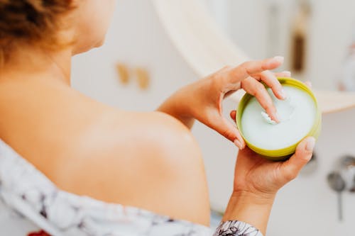 A Woman Applying Cream