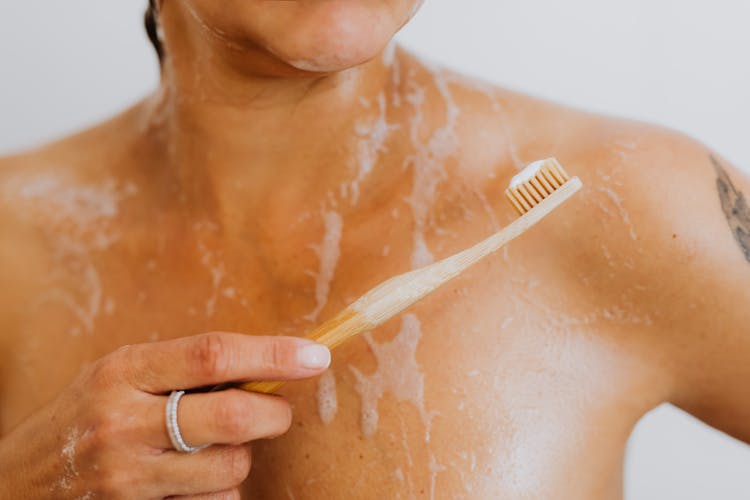 Body And Toothbrush Under Shower