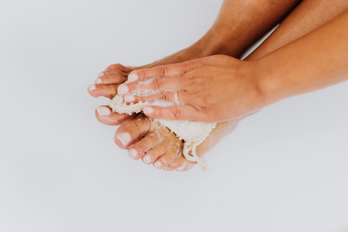 Free A Woman Washing Her Feet Stock Photo