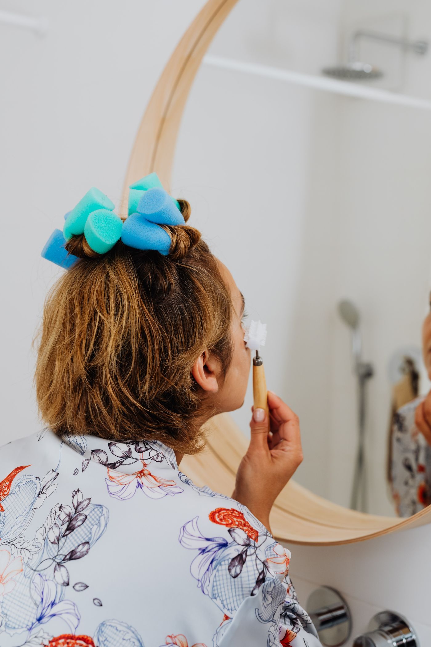 Woman gently massaging her face during a skincare ritual