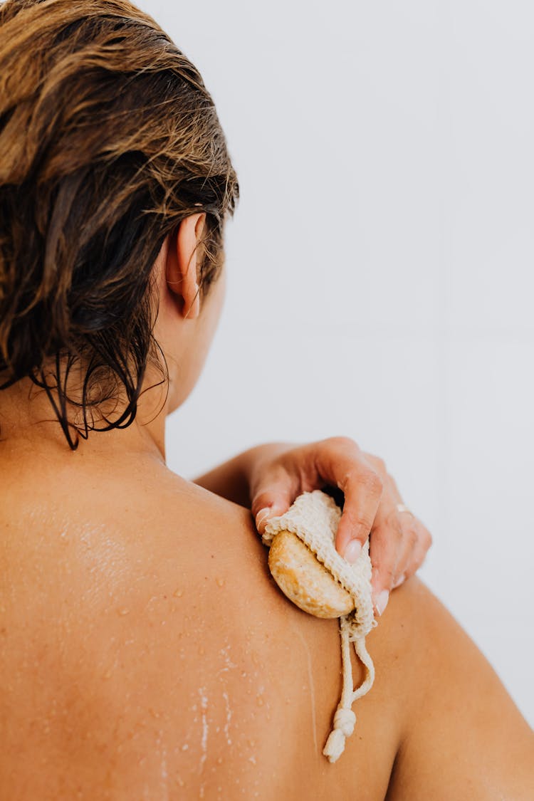 Woman Using Soap In Pouch 