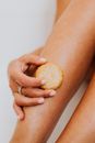 Person Using Soap on Legs