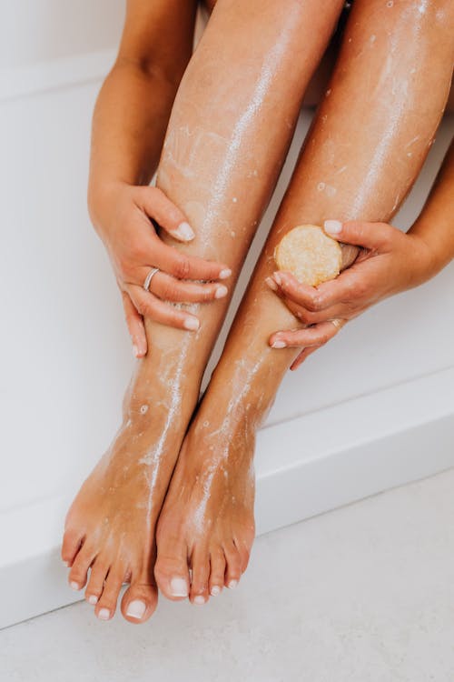 Free Persons Feet on White Surface Stock Photo