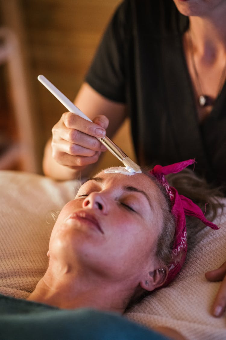 Woman Getting Mask On Massage In Spa