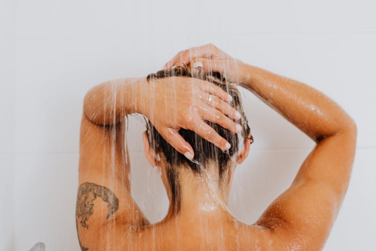 Back View Of Woman in Shower