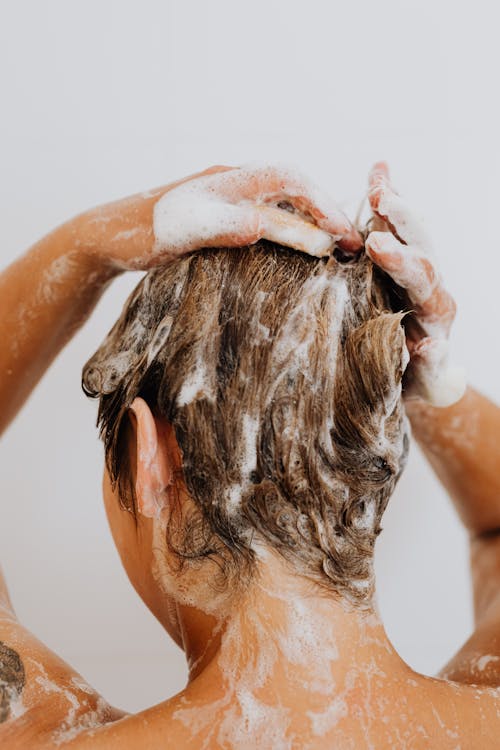 Free Woman Washing Her Hair Stock Photo