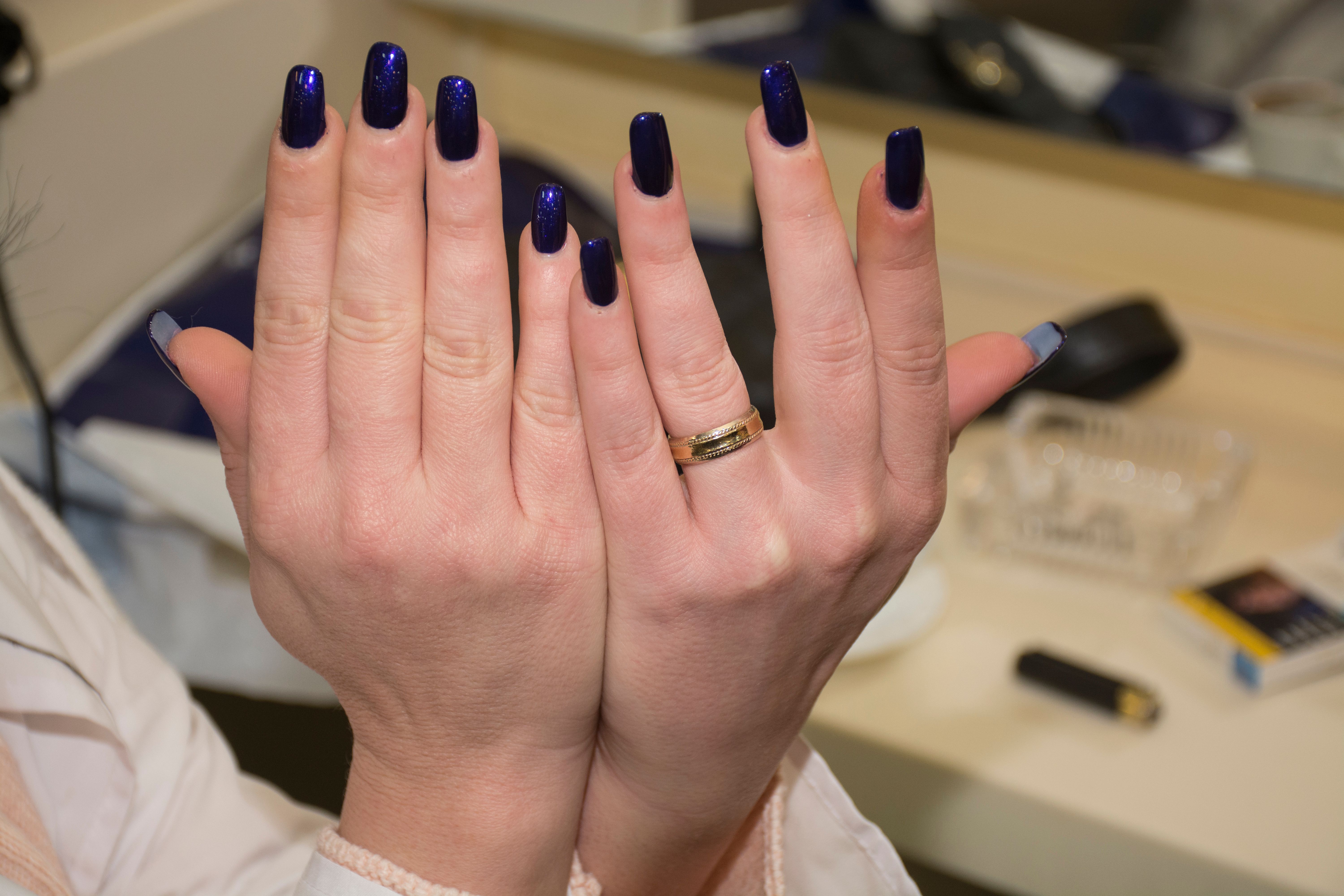 Midnight navy polish on short elegant nails