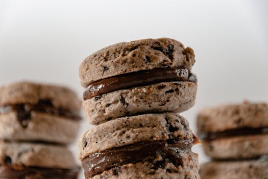 Close-up of chocolate-filled sandwich cookies, perfect for dessert lovers.