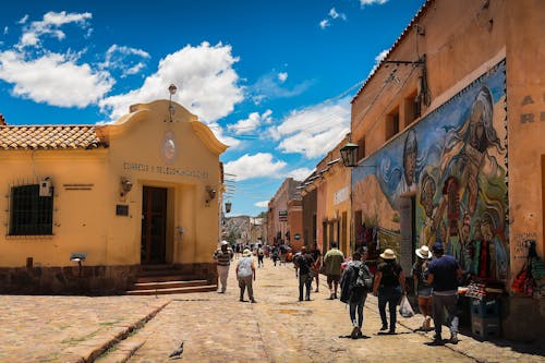 People Walking Old Paved City Street