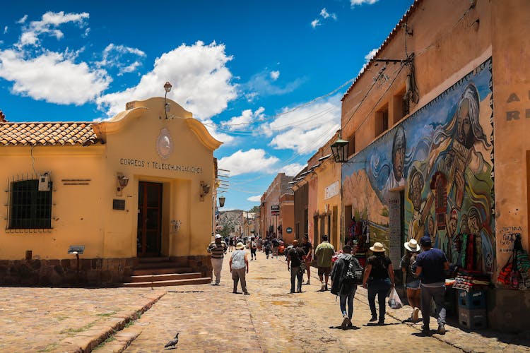 People Walking Old Paved City Street