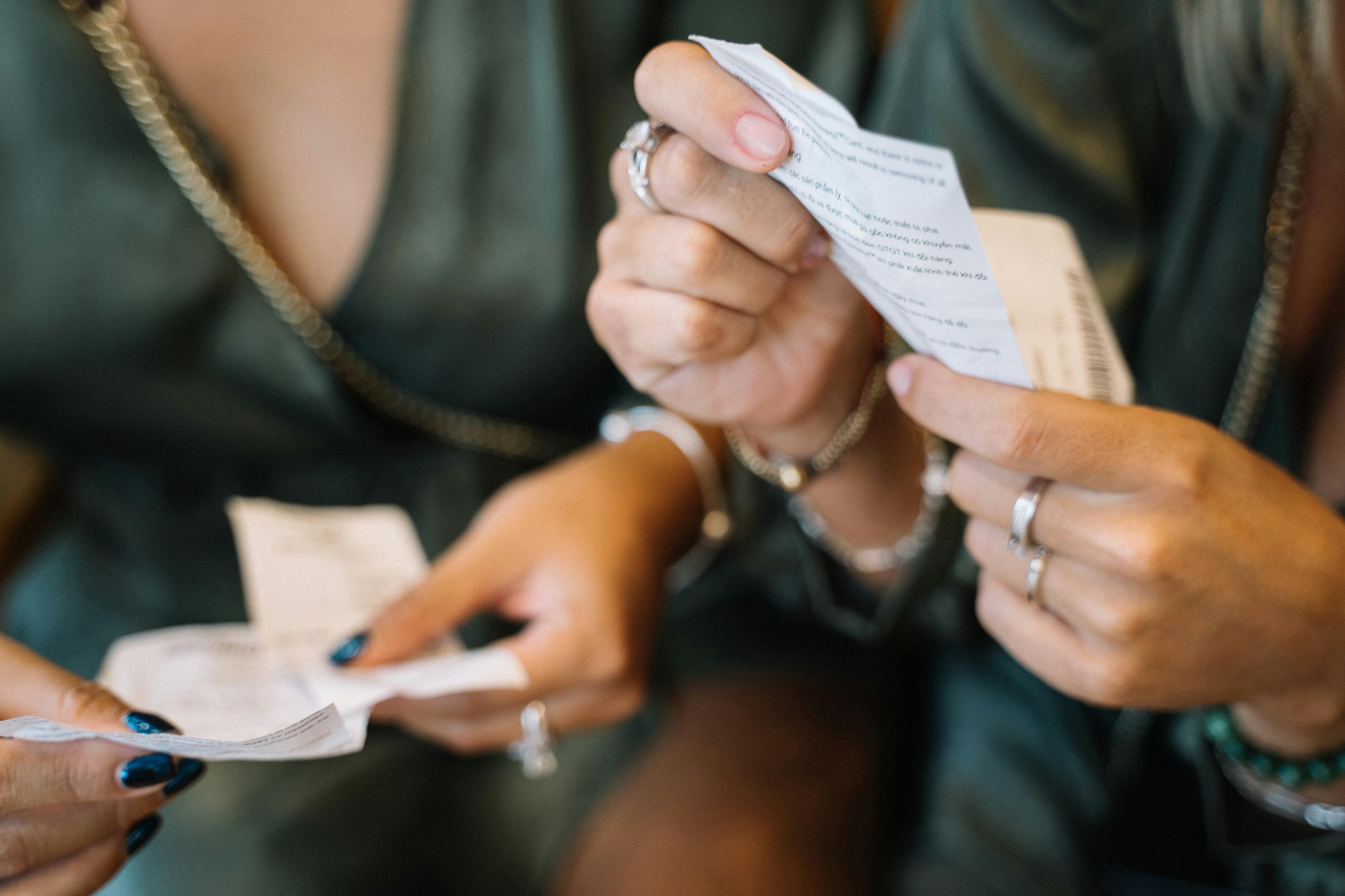 people in twinning outfit holding receipts