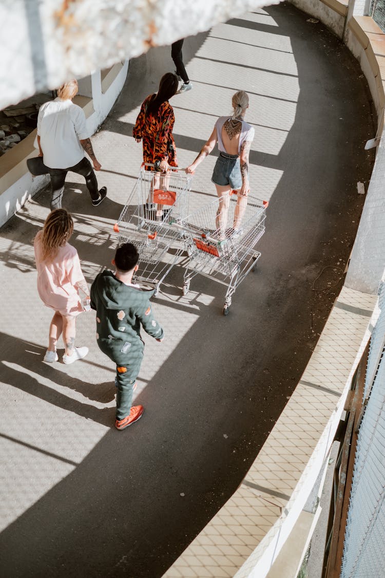 Overhead Shot Of People Pulling Shopping Carts