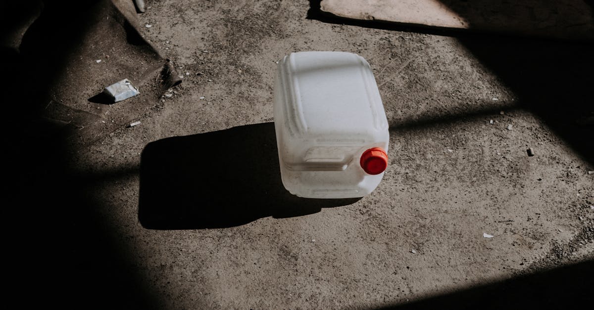 A White Plastic Canister on the Floor
