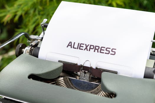 Close-up of a vintage typewriter with Aliexpress text on paper outdoors.