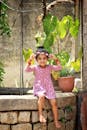 Smiling Girl Sitting on Well